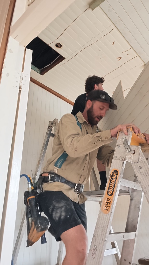 Frame from a clip: fitting ceiling boards
