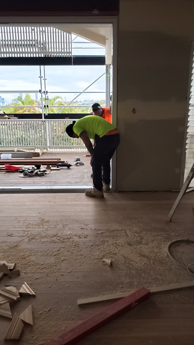 Frame from a clip: a carpenter in the new living area